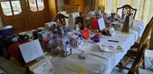 A dining table laden with hamper goodies